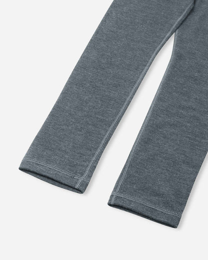 Close-up of the pant legs on the Reima Kinsei kids' merino wool base layer bottoms in melange grey, highlighting the comfortable flat seams.