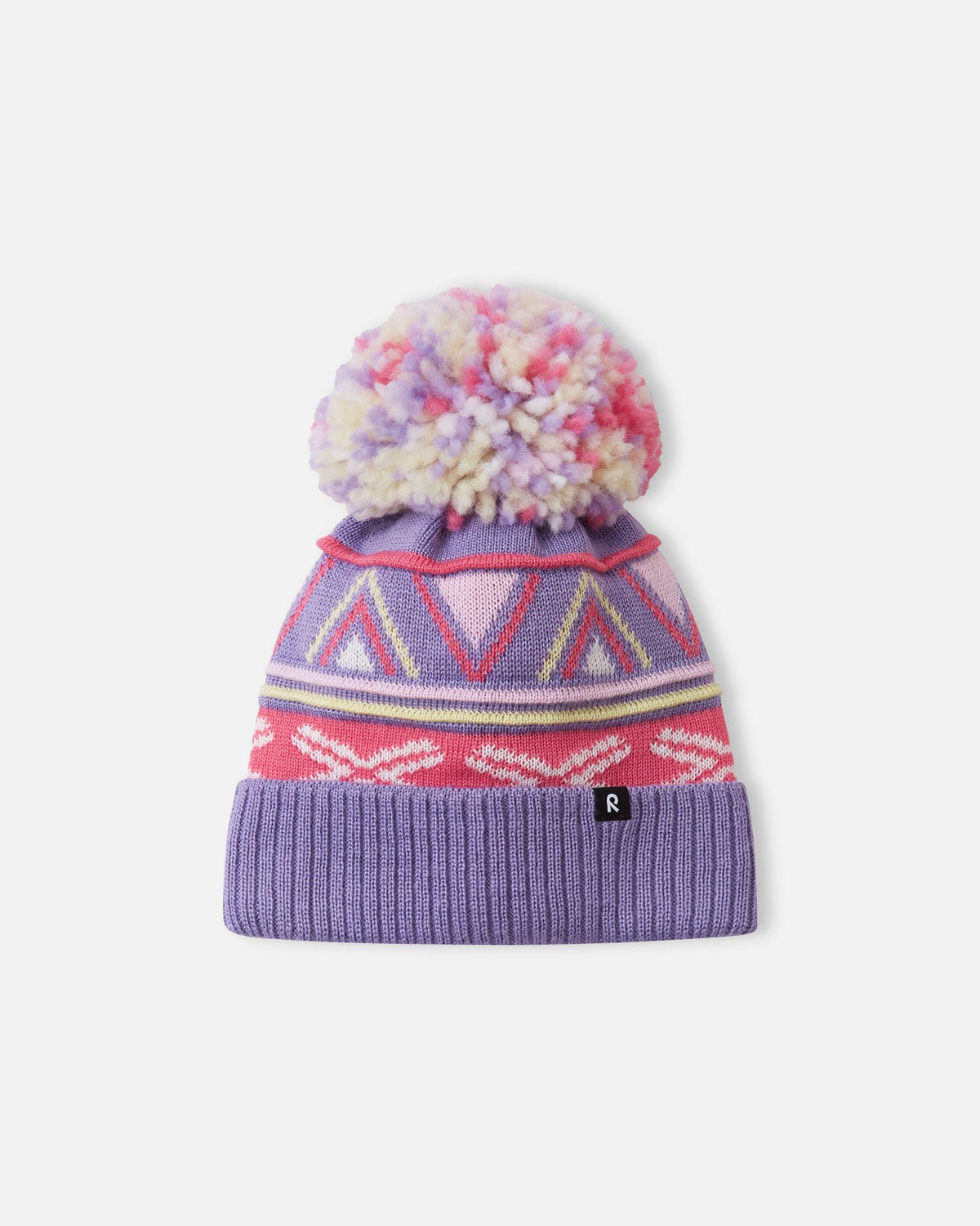 Alternate front flat lay view of the blooming lilac Reima Kirjoen children's jacquard knit winter hat. The image showcases the premium merino wool-blend texture, the small woven black Reima logo tag on the hem, and the fun geometric winter design.