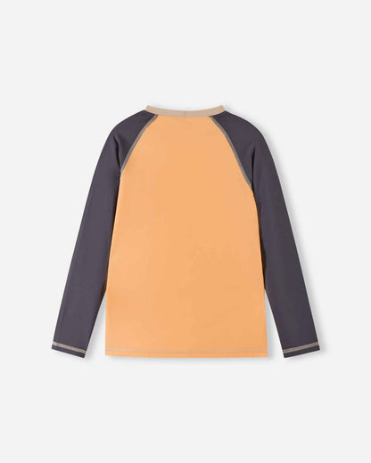 Back view of the apricot Reima Kroolaus kids' UPF 50+ long sleeve swim shirt, showcasing the seamless raglan shoulder design that provides excellent mobility and comfort in the water.