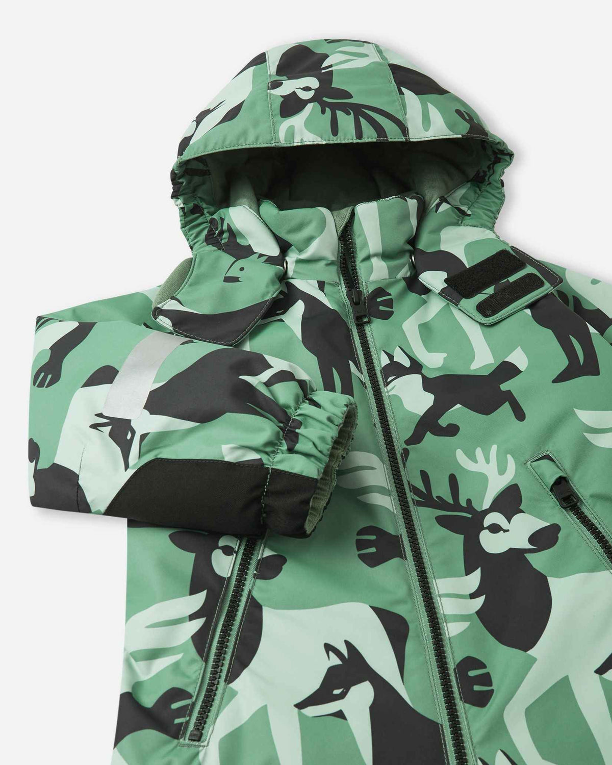 Close-up of the hood and chest on the Reima Kurikka green clay snowsuit, highlighting the durable front zipper and detailed print.