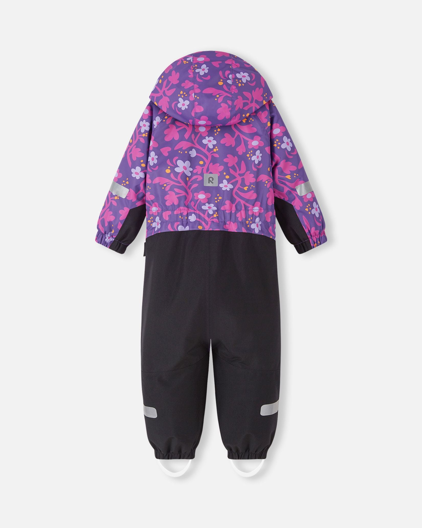 Back view of the Reima Kurikka kids' winter snowsuit in a plum purple floral print, showing the attached hood, a cinched elastic waist for a better fit, and reflective safety patches on the sleeves and legs.