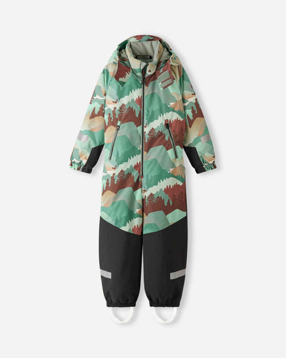Front view of the Reima Kurikka kids' waterproof winter snowsuit in stone green with a forest mountain print, featuring a detachable hood, front zipper, and durable black reinforced pant legs.