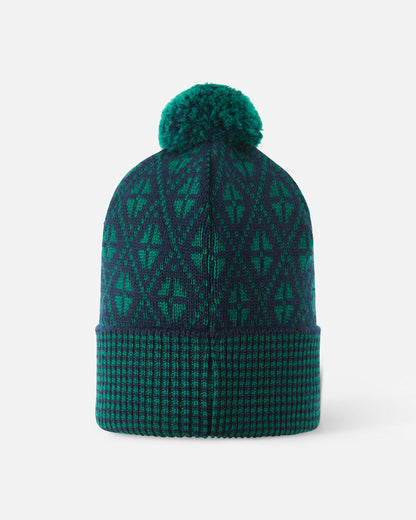 Back view of the navy blue Reima Kuurassa kids' merino wool beanie hat, showing the continuous green geometric knit pattern and the fluffy top pom-pom.