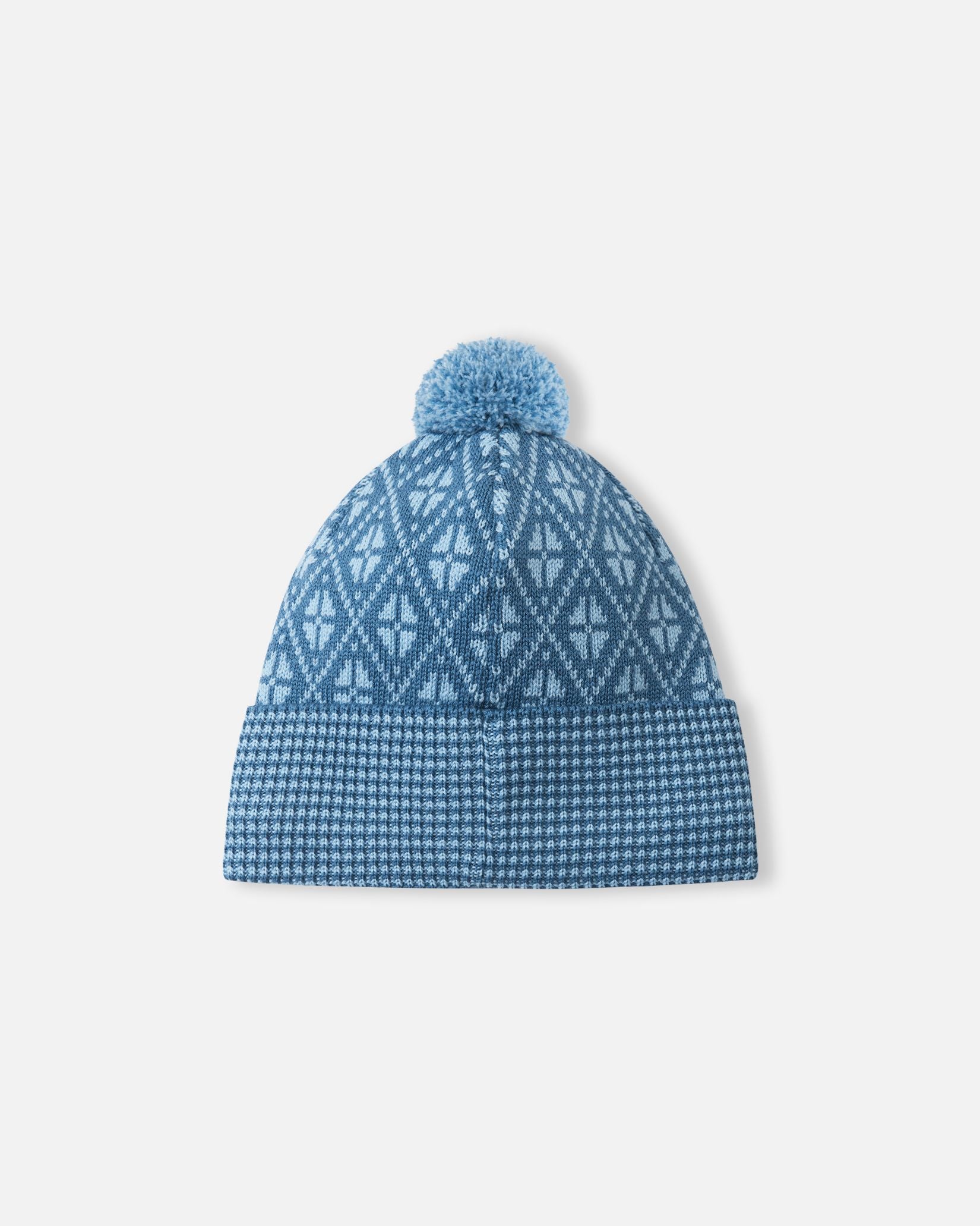 Back view of the ocean blue Reima Kuurassa kids' merino wool beanie hat, showing the continuous geometric knit pattern and the fluffy top pom-pom.