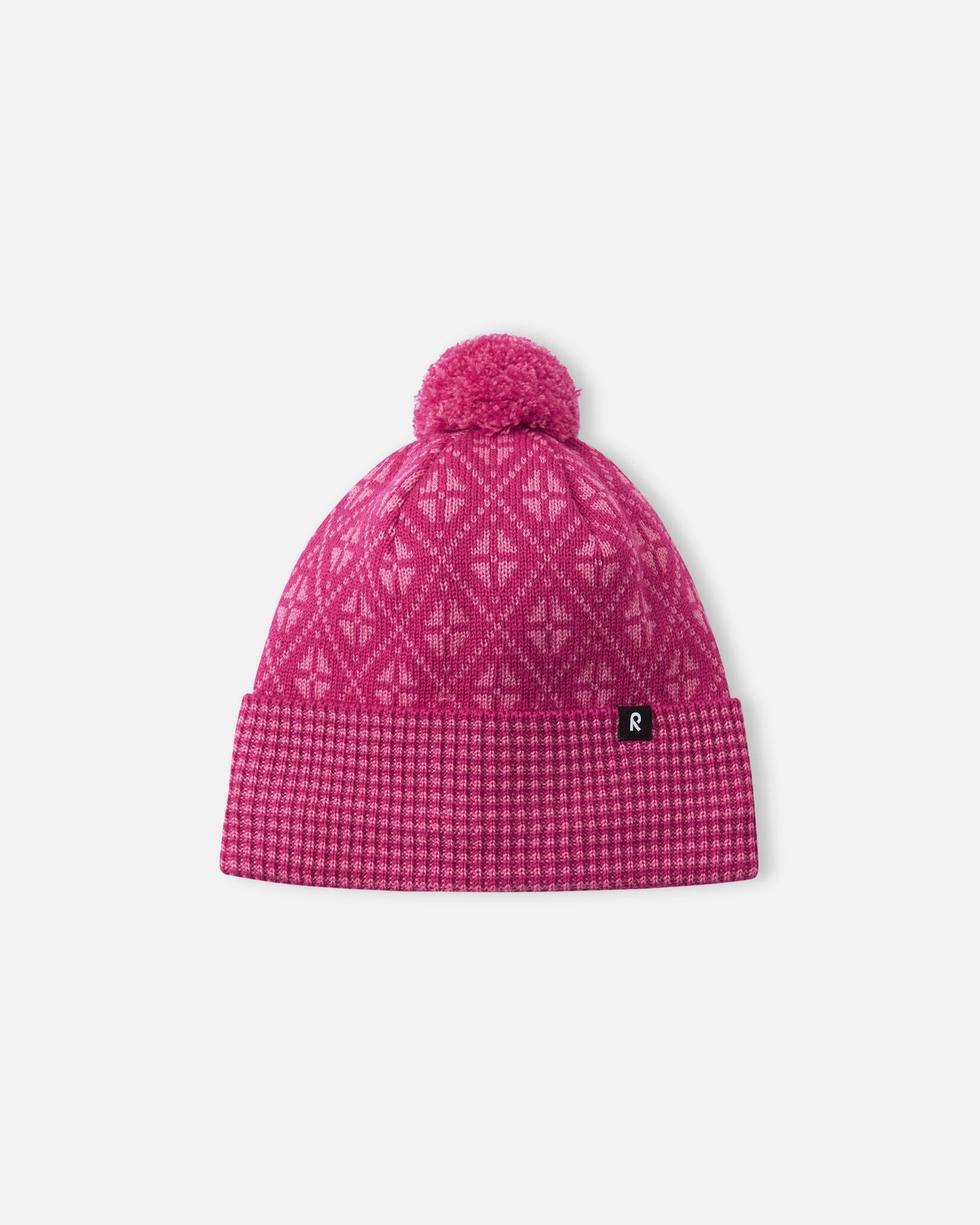 Front view of the Reima Kuurassa kids' merino wool beanie hat in a vibrant rosy berry pink, featuring a Nordic-inspired geometric pattern, a ribbed fold-over brim, and a matching pom-pom.