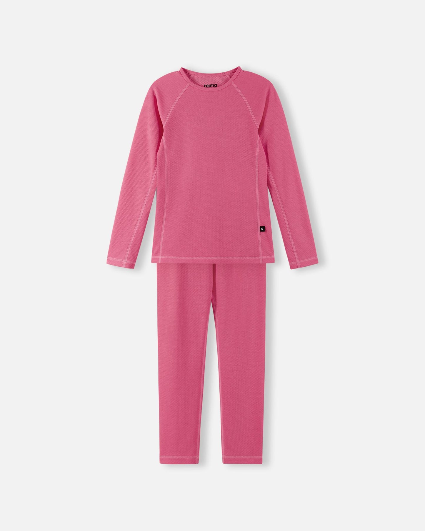 Front view of the Reima Lani kids' moisture-wicking Thermolite base layer set in soft coral, featuring a thermal long-sleeve top and matching leggings designed for cold-weather layering.