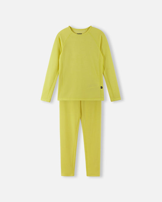 Front view of the Reima Lani kids' moisture-wicking Thermolite base layer set in yellow, featuring a long-sleeve thermal shirt and matching leggings for cold-weather outdoor activities.