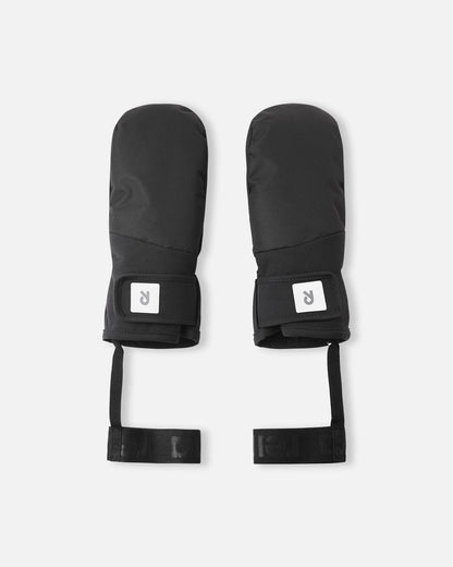 Flat lay view of the backs of the all-black Reima Lapases kids' ski mittens, highlighting the durable waterproof ReimaTec fabric, adjustable hook-and-loop wrist straps for a secure fit, and attached elastic safety wrist leashes.