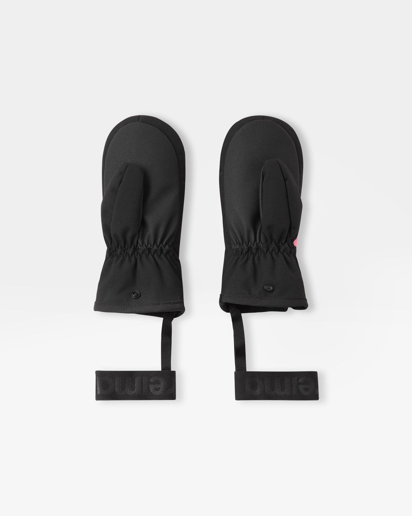 Flat lay view of the palms of the soft coral Reima Lapases kids' ski mittens, showcasing the durable black reinforced gripping surface on the thumbs and palms designed for securely holding ski poles.