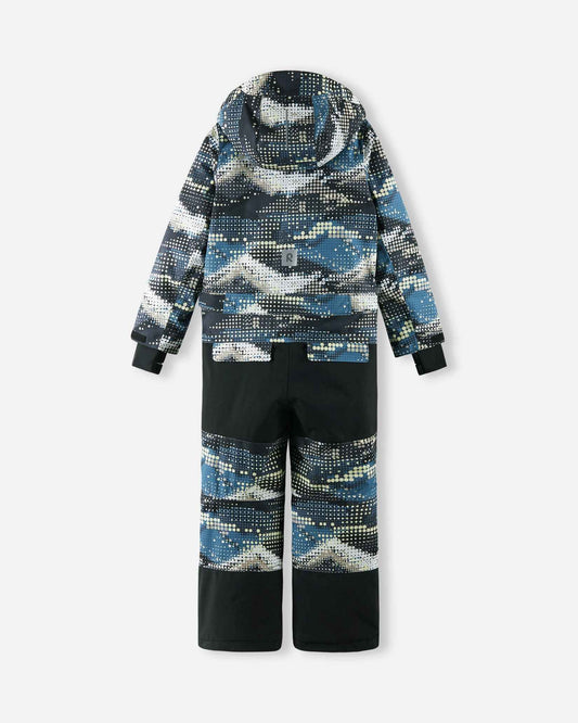 Full back view of the Reima Lappea kids' ski suit featuring a soft black and blue geometric pattern on the upper body and lower legs, highly durable solid black reinforced fabric on the seat and knees, and a reflective safety patch centered on the lower back.
