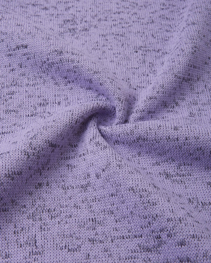 Macro close-up of the breathable, soft-brushed fleece knit fabric on the Reima Laskien kids' jacket, demonstrating its premium warmth and moisture-wicking properties.