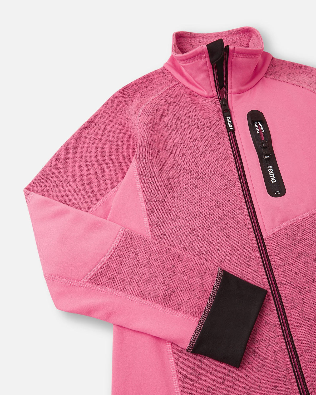 Close-up of the secure zippered chest pocket on the soft coral Reima Laskien kids' fleece jacket, featuring a black zipper pull and reinforced trim.