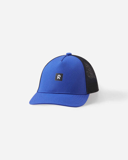 Front view of the Reima Liplatus kids' organic cotton cap in sparkly blue, showing a vibrant blue front panel, classic curved visor, black mesh back, and the signature Reima logo patch.