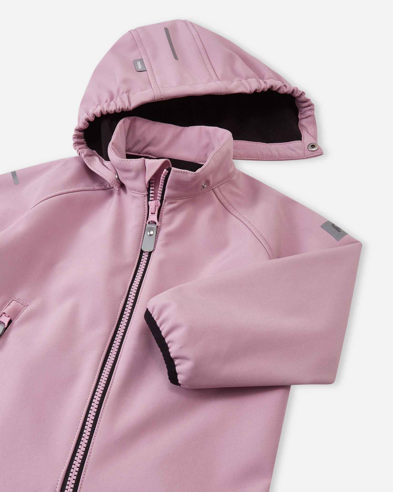 Close-up of the hood and high collar on the grey pink Reima Mjosa kids' softshell suit, highlighting the cozy fleece lining and safe, detachable hood mechanism.