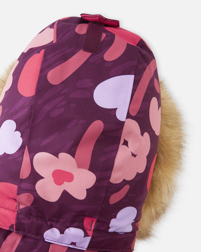 Top view of the Reima Muurame jacket hood in deep purple floral, featuring a velcro adjustment strap at the crown to customize the fit over a winter beanie or hat.