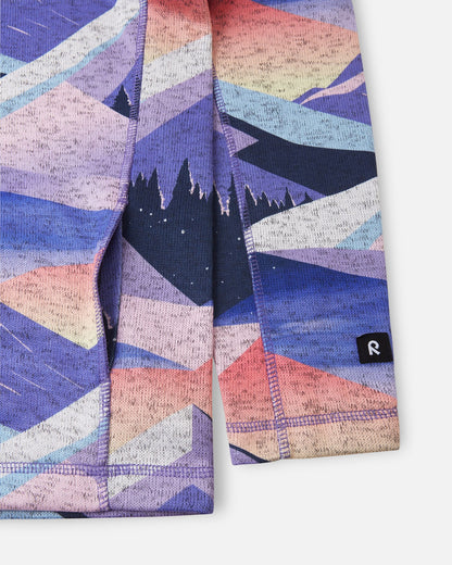 Close-up detail of the side pocket trim and sleeve cuff featuring the branded Reima logo tag on the breezy violet Reima Niksini kids' fleece jacket.