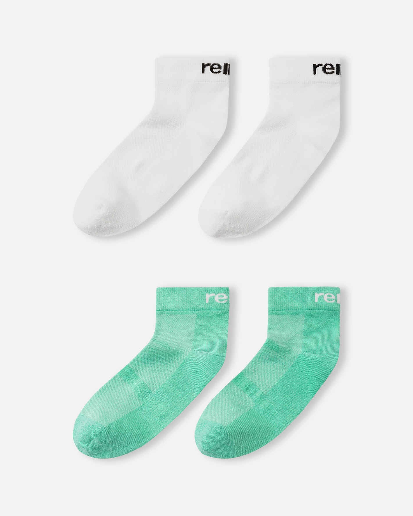 Close-up detail of the Reima Nilkat kids' fresh mint green ankle sock, highlighting the ventilated mesh paneling on the instep for moisture control and the white Reima logo on the ribbed ankle band.