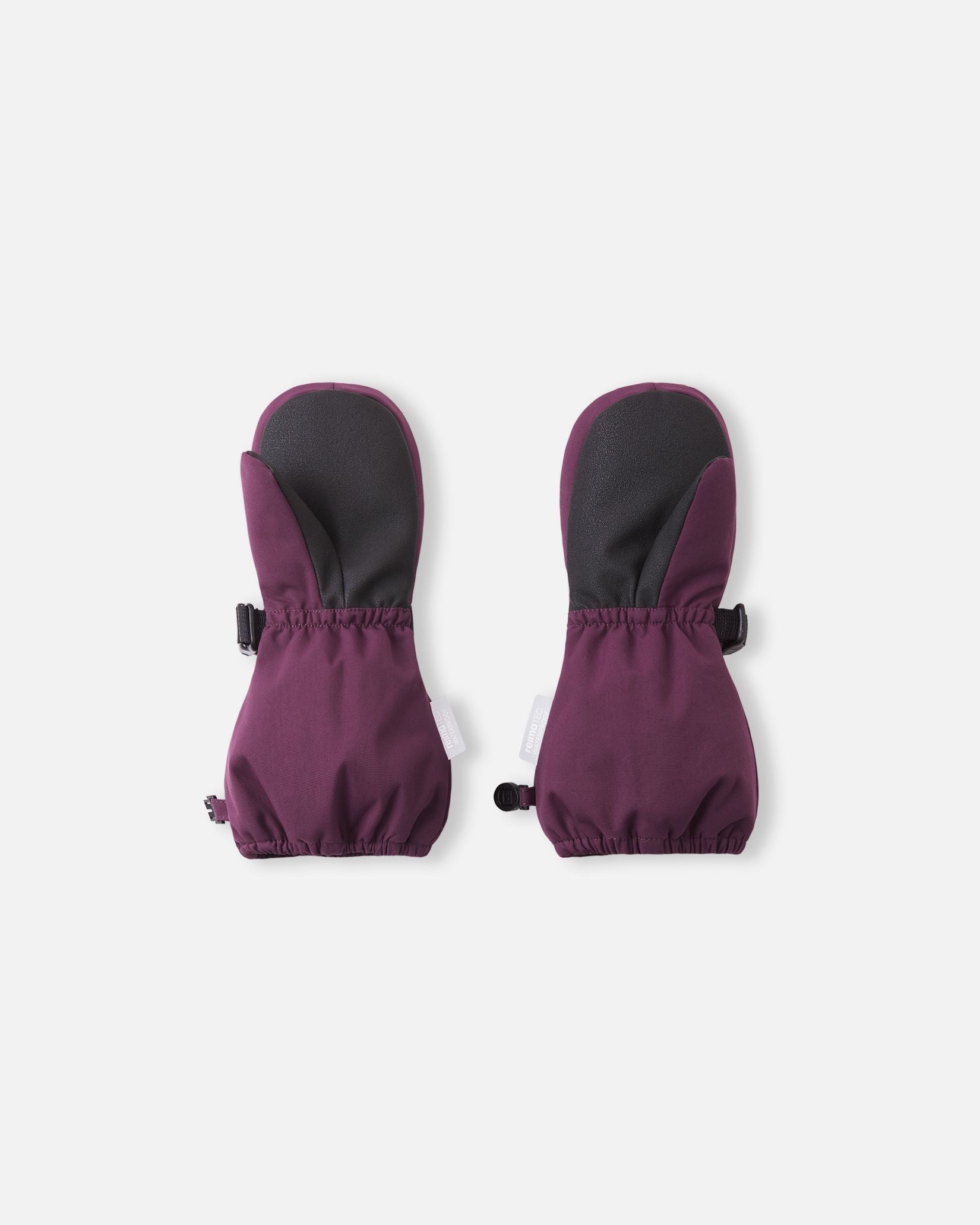 Palm side view of the Reima Ote kids' waterproof mittens in deep purple, detailing the highly durable black reinforced palm and thumb designed for gripping ski poles and playing in harsh winter snow.