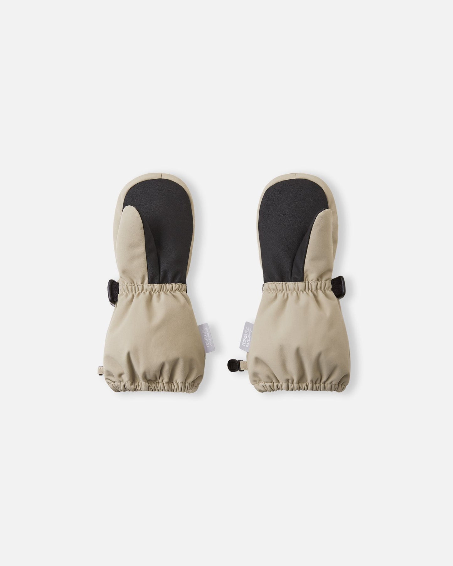 Palm view of the Reima Ote kids' winter mittens in earthy beige, detailing the highly durable black reinforced palm and thumb designed for gripping sleds and playing in harsh winter conditions.