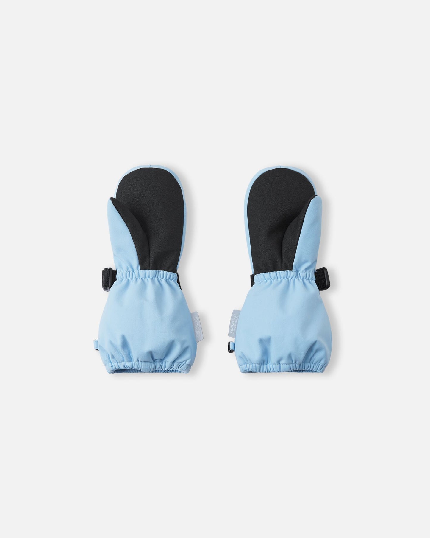 Palm view of the Reima Ote kids' winter snow mittens in frozen blue, featuring a heavy-duty black reinforced grip on the palm and thumb, alongside an elastic gathered wrist to seal out cold drafts.