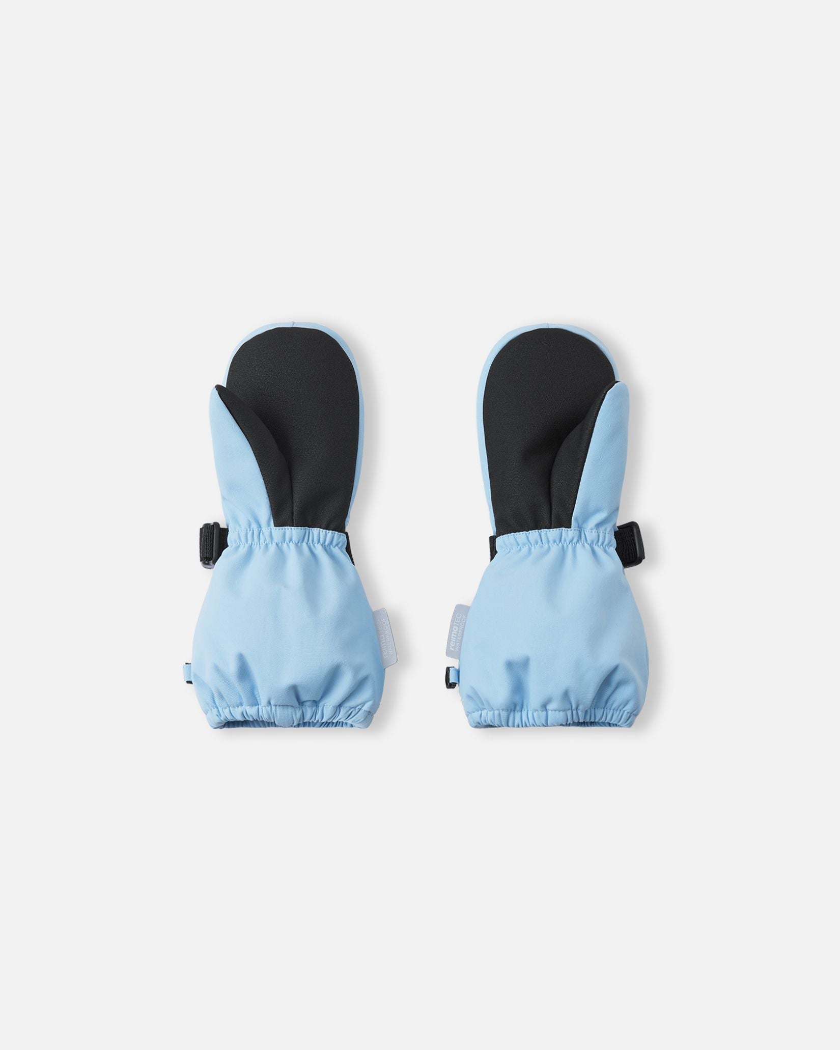 Palm view of the Reima Ote kids' winter snow mittens in frozen blue, featuring a heavy-duty black reinforced grip on the palm and thumb, alongside an elastic gathered wrist to seal out cold drafts.