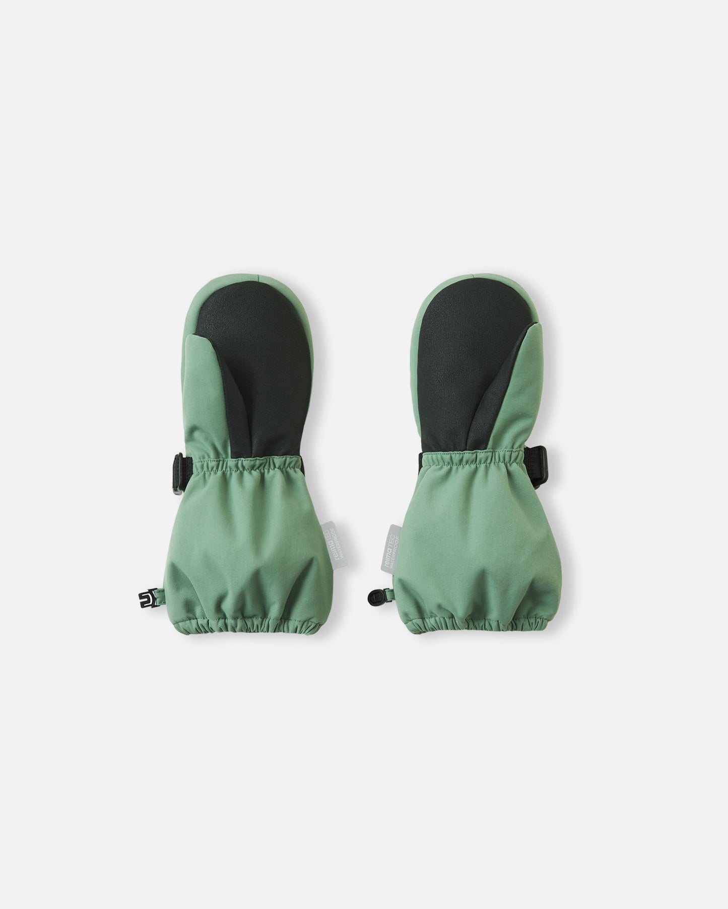 Palm view of the Reima Ote kids' winter snow mittens in green clay, featuring a heavy-duty black reinforced grip on the palm and thumb, and an elastic gathered wrist to keep out cold drafts.