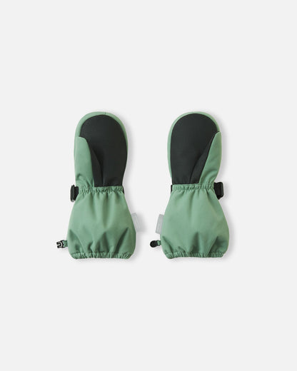 Palm view of the Reima Ote kids' winter snow mittens in green clay, featuring a heavy-duty black reinforced grip on the palm and thumb, and an elastic gathered wrist to keep out cold drafts.