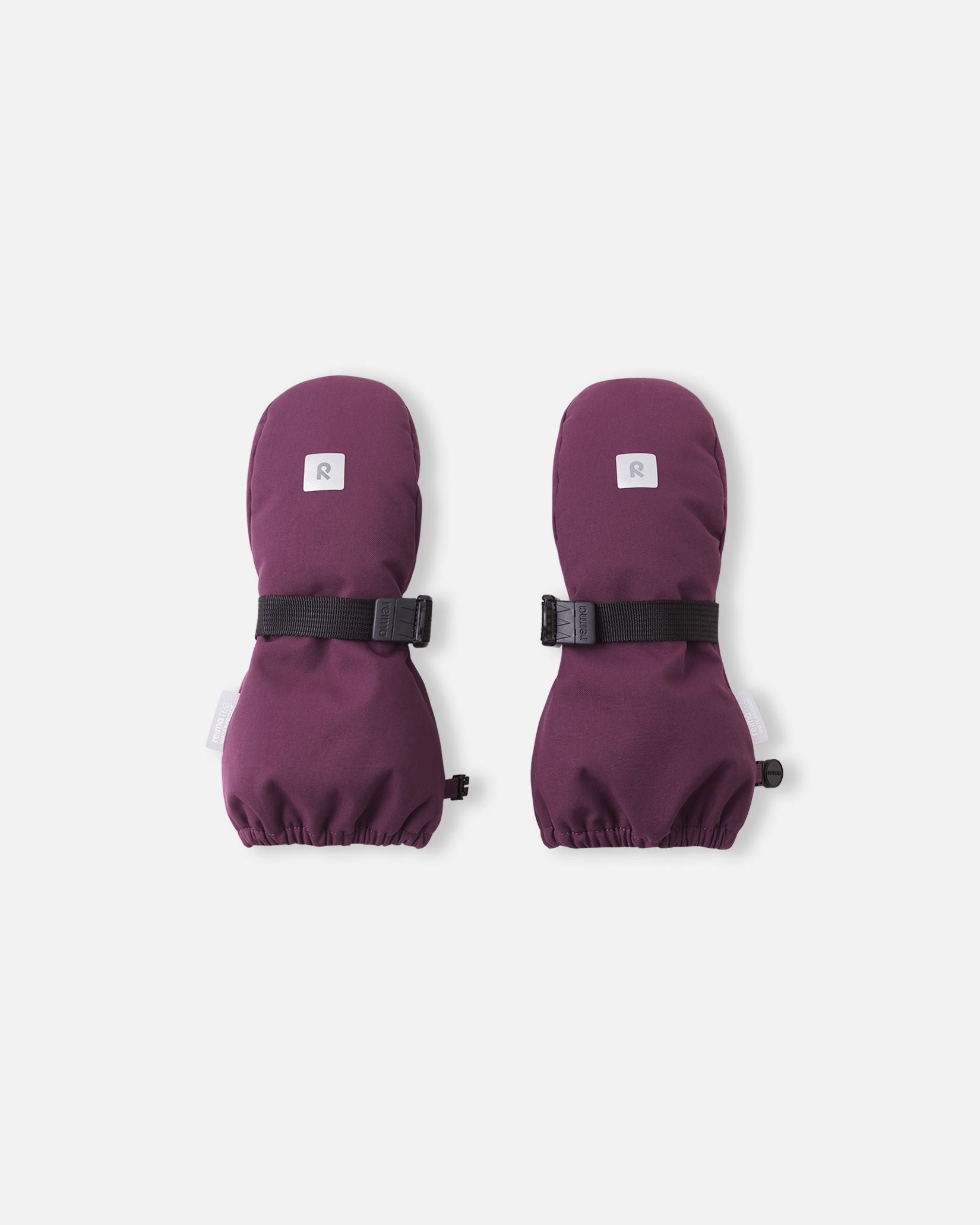 Front top view of the deep purple Reima Ote kids' winter mittens, featuring a highly visible reflective safety logo, a durable waterproof exterior, and a secure adjustable velcro wrist strap to keep snow out.