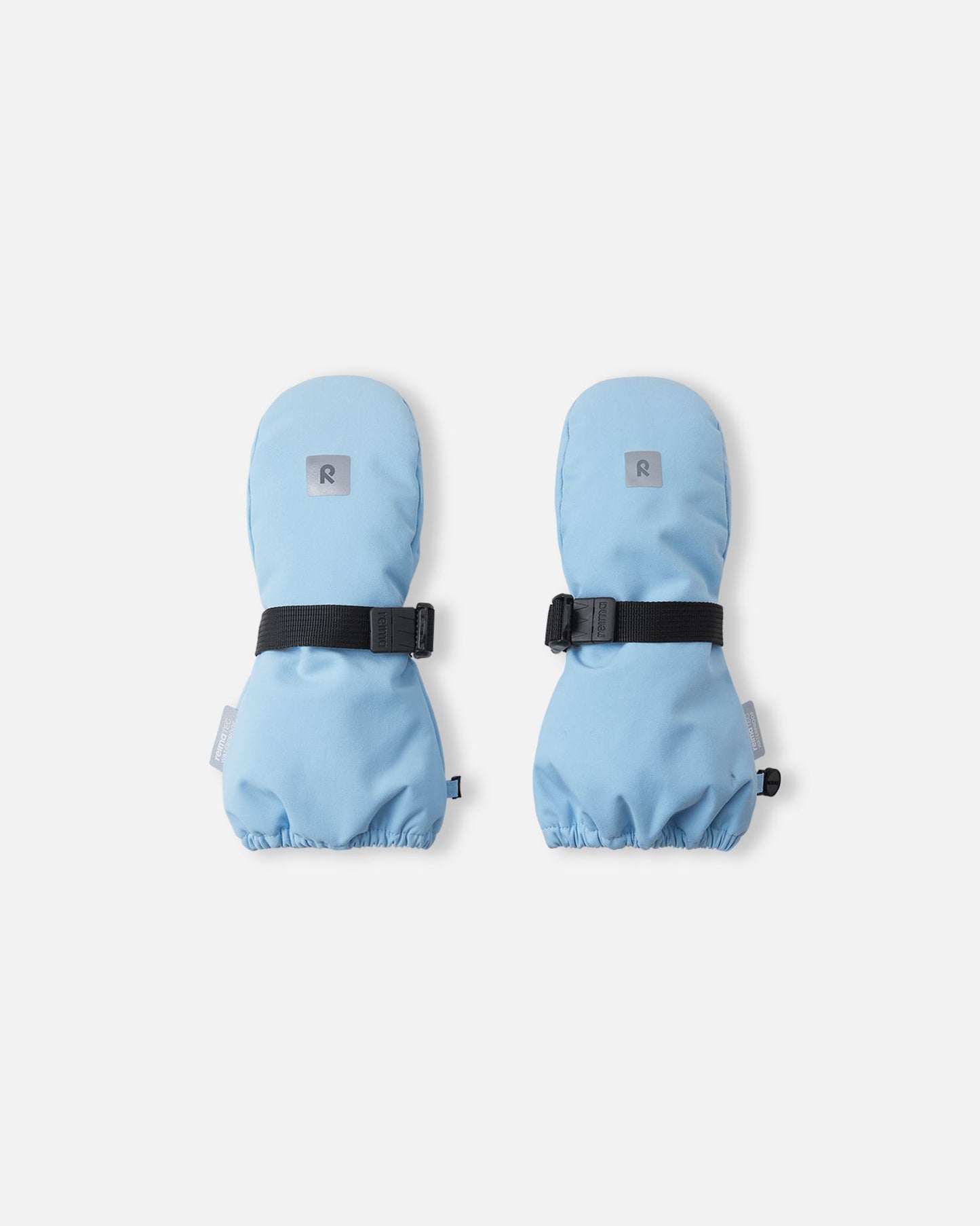 Top view of the highly durable Reima Ote kids' winter mittens in frozen blue, showcasing an adjustable black velcro wrist strap for a secure fit and a reflective Reima logo patch for high winter visibility.