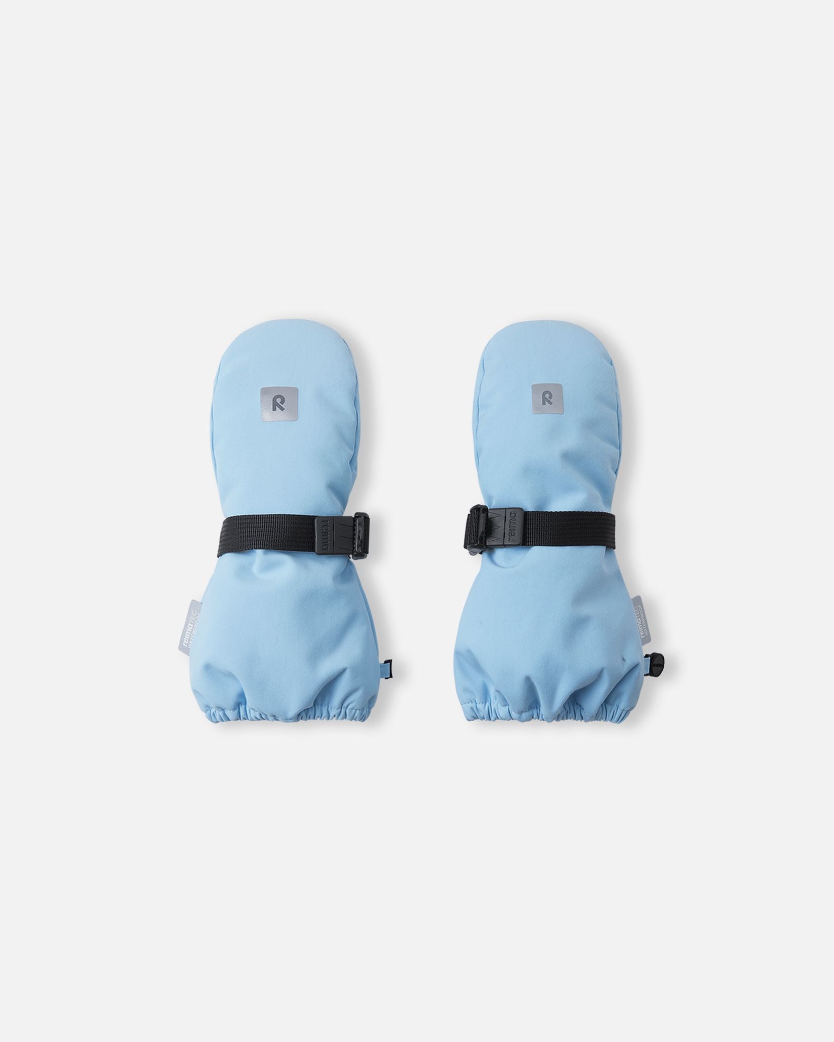 Top view of the highly durable Reima Ote kids' winter mittens in frozen blue, showcasing an adjustable black velcro wrist strap for a secure fit and a reflective Reima logo patch for high winter visibility.