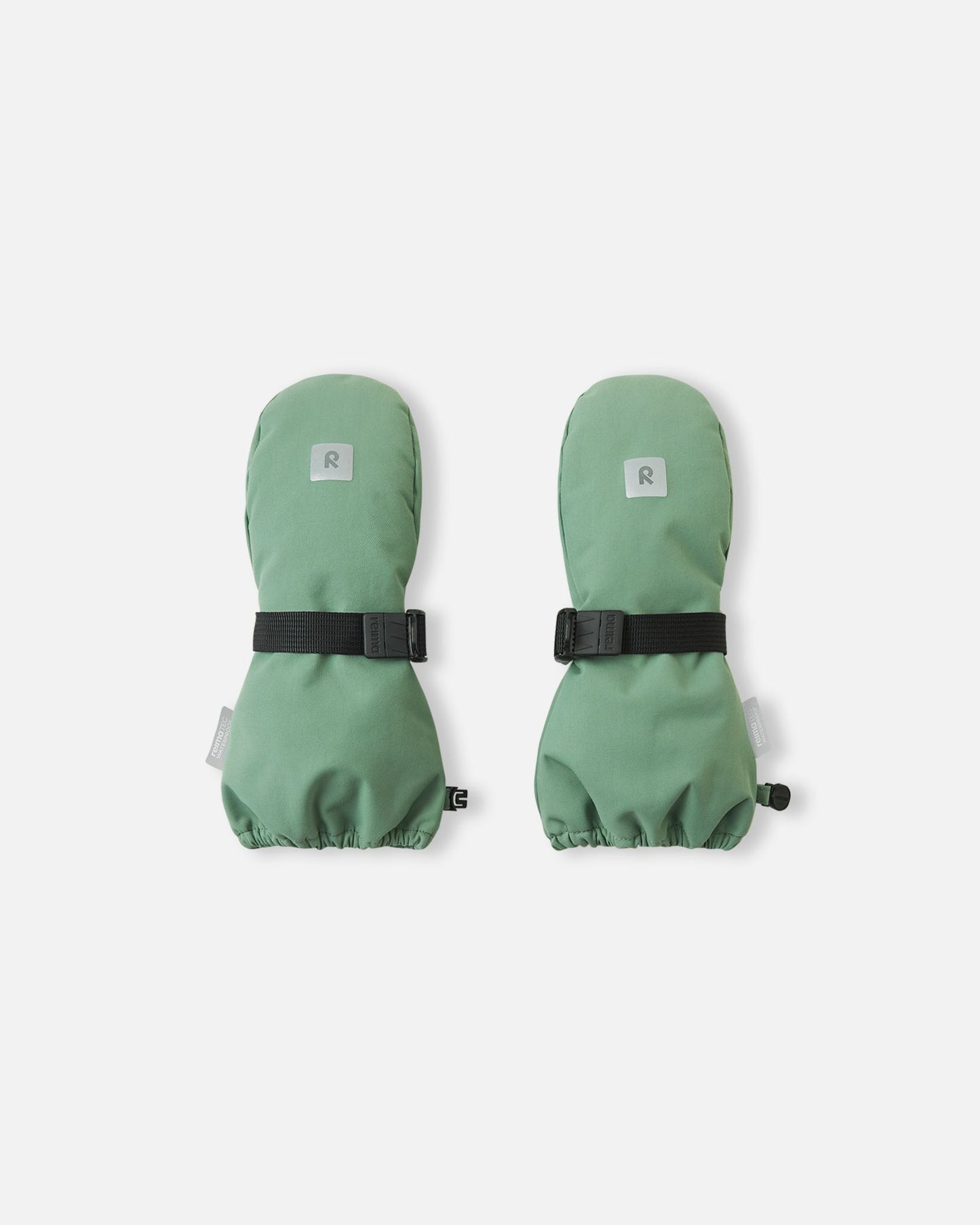 Top view of the highly durable Reima Ote kids' winter mittens in green clay, showcasing an adjustable velcro wrist strap for a secure fit and a reflective Reima logo patch for winter visibility.