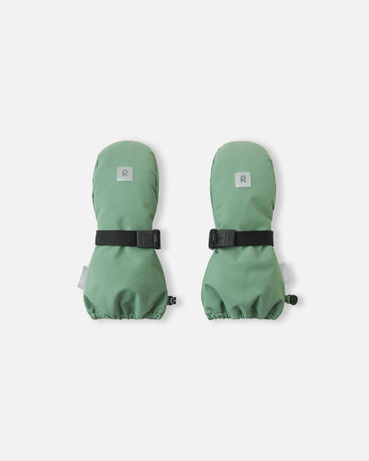 Top view of the highly durable Reima Ote kids' winter mittens in green clay, showcasing an adjustable velcro wrist strap for a secure fit and a reflective Reima logo patch for winter visibility.