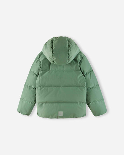 Back flat lay perspective of the green clay Reima Paimio children's down jacket, highlighting the attached snap-away hood, seamless quilted insulation, and a lower-back reflective safety patch.