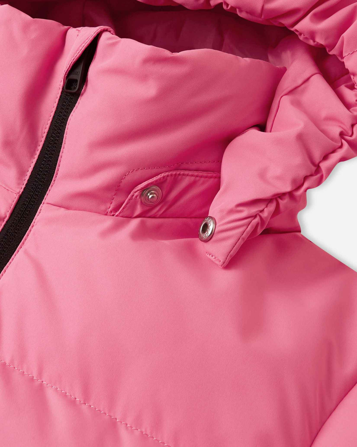 Close-up view of the collar on the soft coral pink Reima Paimio children's down jacket, revealing the metallic snap buttons that allow the insulated hood to safely and easily detach if it catches on tree branches or playground equipment.