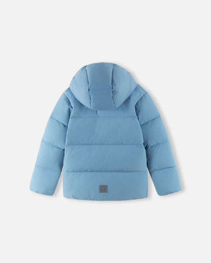 Back flat lay view of the Reima Paimio children's winter down puffer jacket in cloudy blue with the hood attached, showcasing the insulated quilted design and a reflective safety patch near the lower hem.