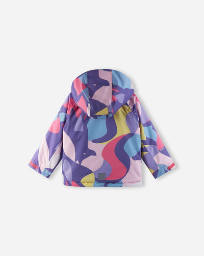 The back view of the Blooming Lilac Reima Palsi ski jacket featuring an abstract pattern of pink, purple, blue, and yellow shapes with a reflective tag near the bottom hem.