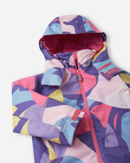 Close-up of the hood and collar on the Blooming Lilac Reima Palsi ski jacket featuring an abstract pattern of pink, purple, blue, and yellow shapes. The inside of the hood is lined with bright pink fabric.