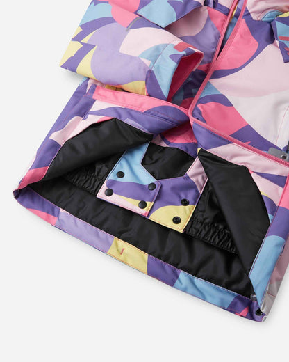 A close-up view of the inner black snow skirt and snap button closures on the Blooming Lilac Reima Palsi ski jacket.