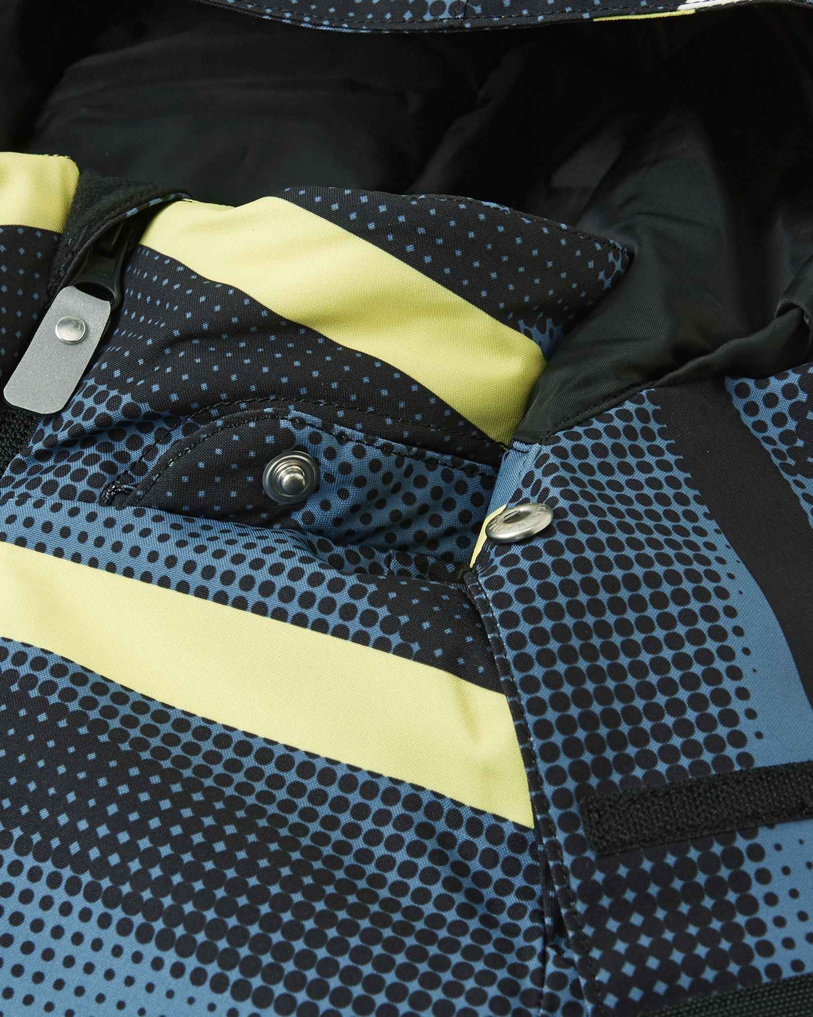 The front chest zipper and yellow stripe details on the dark blue winter coat.