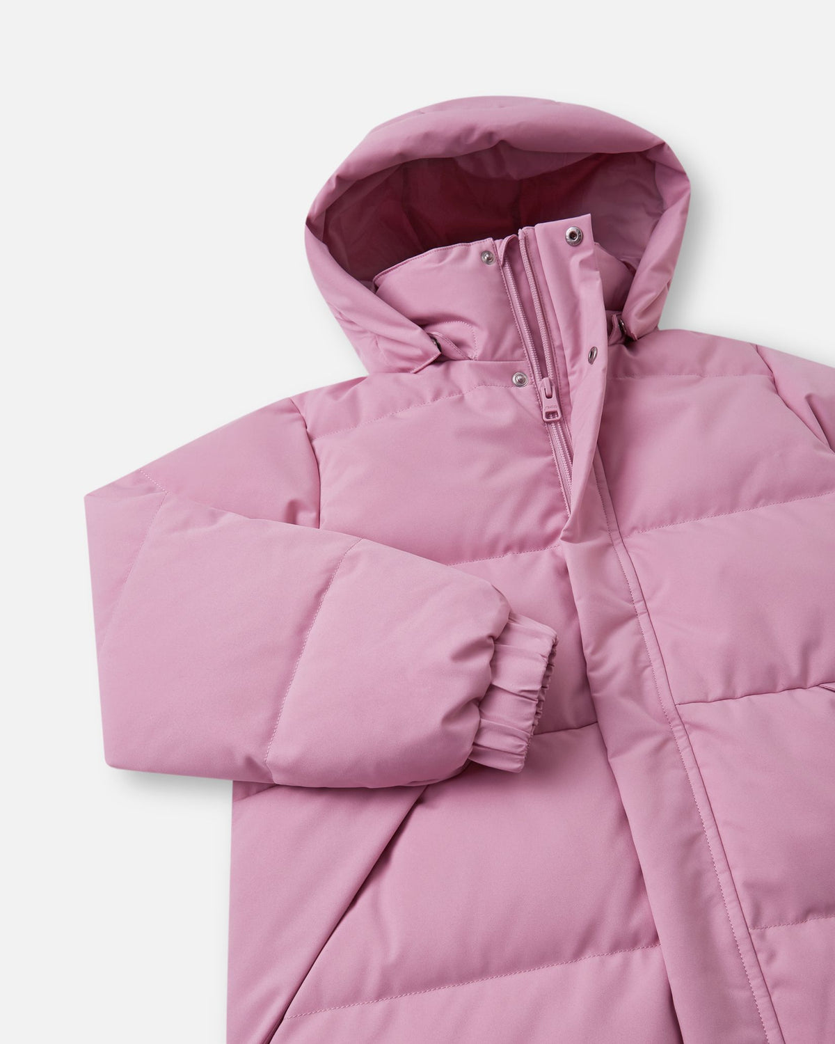 Angled upper-torso close-up of the grey pink Reima Parkkala kids' down jacket, highlighting the high padded collar, smooth front zipper, and thick protective storm flap with snap closures.