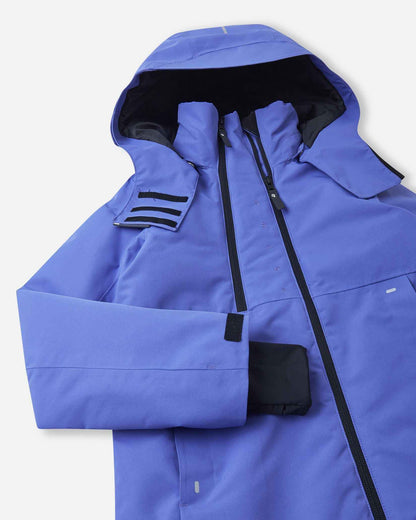 Close-up on the upper chest and collar of the breezy violet Reima Perille snow jacket, emphasizing the secondary front ventilation zipper, durable main zipper, and secure hook-and-loop hood attachments.