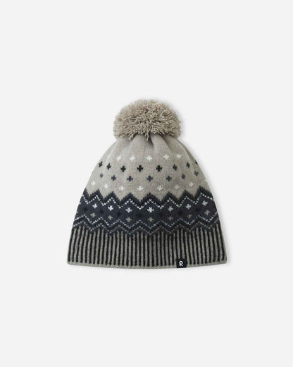 Alternate front flat lay view of the black and earthy grey Reima Pohjoinen children's Nordic knit beanie, showcasing the 100% merino wool outer shell designed for natural temperature regulation in sub-zero weather.