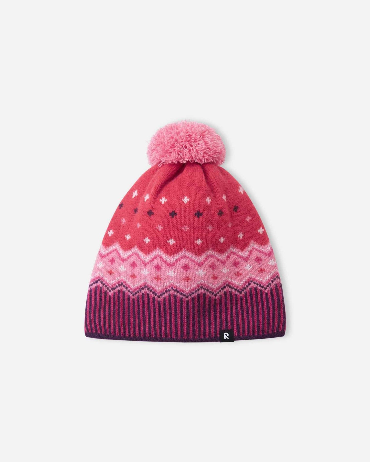 Alternate front flat lay view of the deep purple and pink Reima Pohjoinen children's Nordic knit beanie, showcasing the premium merino wool outer shell designed for natural temperature regulation in sub-zero weather.