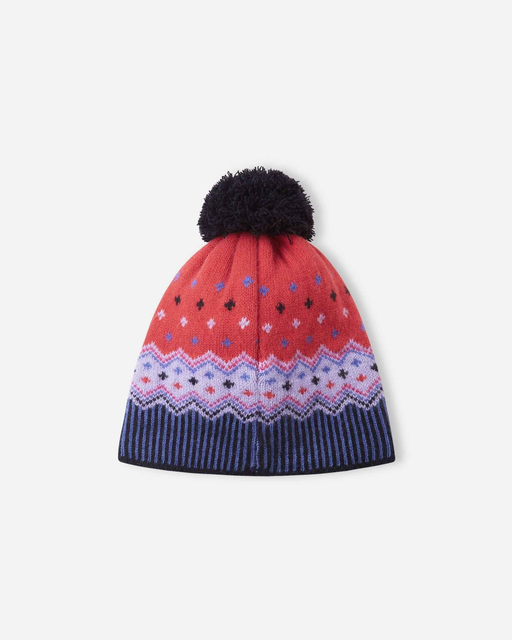 Back flat lay view of the breezy violet Reima Pohjoinen kids' merino wool beanie, highlighting the continuous knitted Fair Isle pattern in red and purple tones, and the durable navy pom-pom construction.