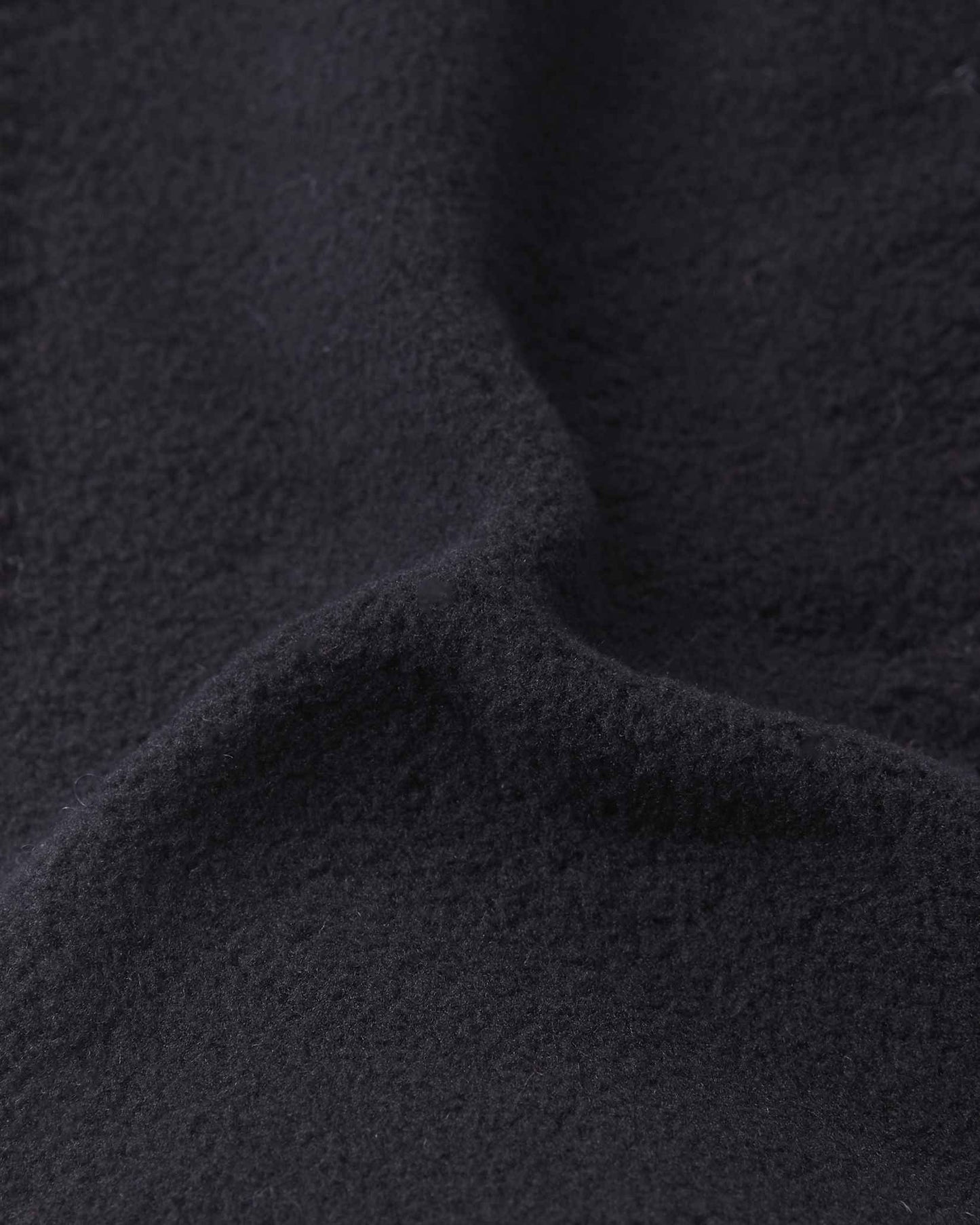 Close-up of the soft black thermal fleece lining inside the breezy violet Reima Pohjoinen kids' merino wool beanie, engineered for itch-free comfort, extra wind protection, and maximum heat retention.