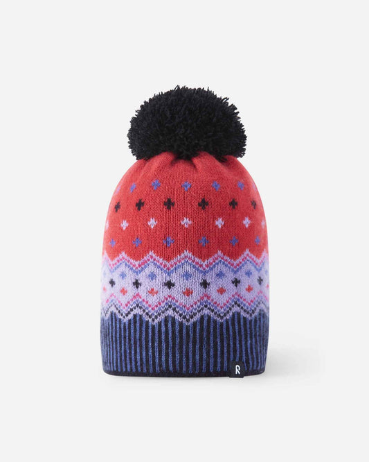 Front flat lay view of the breezy violet Reima Pohjoinen kids' merino wool beanie, displaying a vibrant red, light purple, and navy blue Nordic geometric pattern, ribbed hem, navy pom-pom, and reflective logo badge.