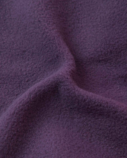 Close-up of the soft dark purple thermal fleece lining inside the Reima Pohjoinen kids' merino wool beanie, engineered for itch-free comfort, wind resistance, and maximum heat retention.
