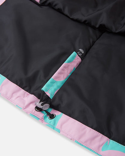 Close-up detail of the inner bottom hem on the Reima Posio girls' winter ski jacket in light heather, featuring an adjustable elastic bungee cord and toggle lock designed to seal out cold drafts.