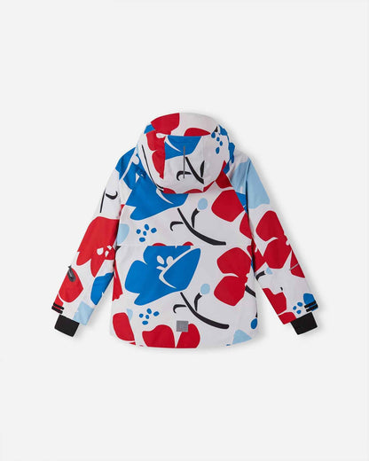 Back view of the white Reima Posio kids' waterproof ski jacket, displaying the continuous bright floral print, a protective hood, and a reflective safety patch at the lower back hem.