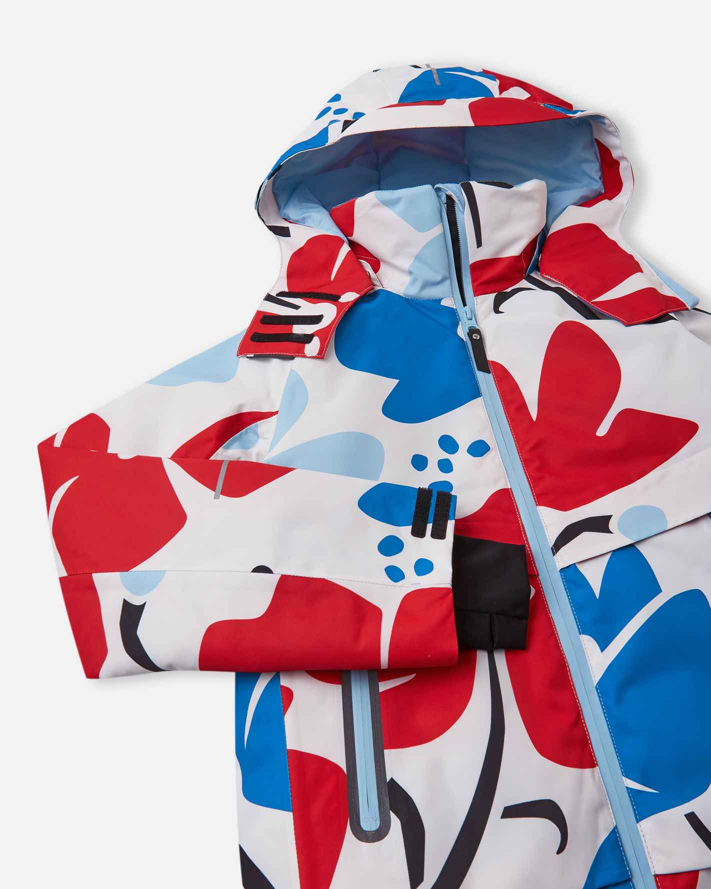 Angled presentation of the Reima Posio youth winter ski apparel, highlighting the smooth-gliding front zipper, weather-blocking high collar, and adjustable snow-proof cuffs.